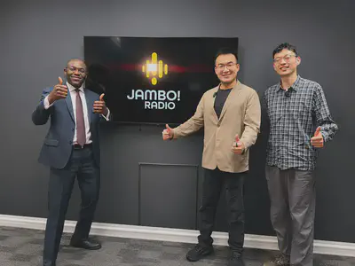 Mingshu Wang, Rui Deng, and Dr Adetunmise Dada in the Jambo! Radio Scotland studio following the live interview.